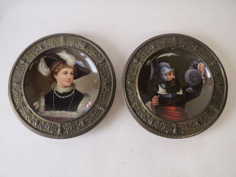 Pair of late C19 continental brass mounted plates painted with C17 style, male and female figures