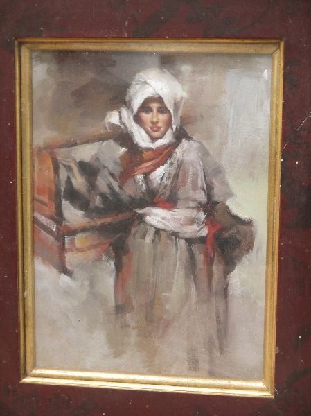 Oil on board portrait of an Arab boy in tribal attire