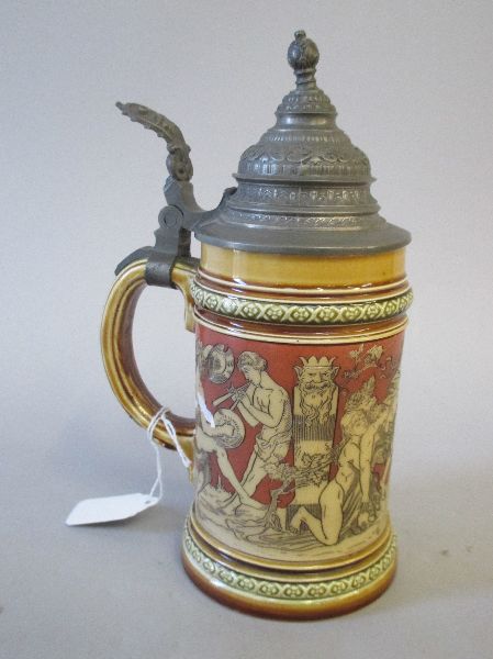 Mettlach stoneware pewter lidded tankard decorated with continuous band of bacchanalian scene