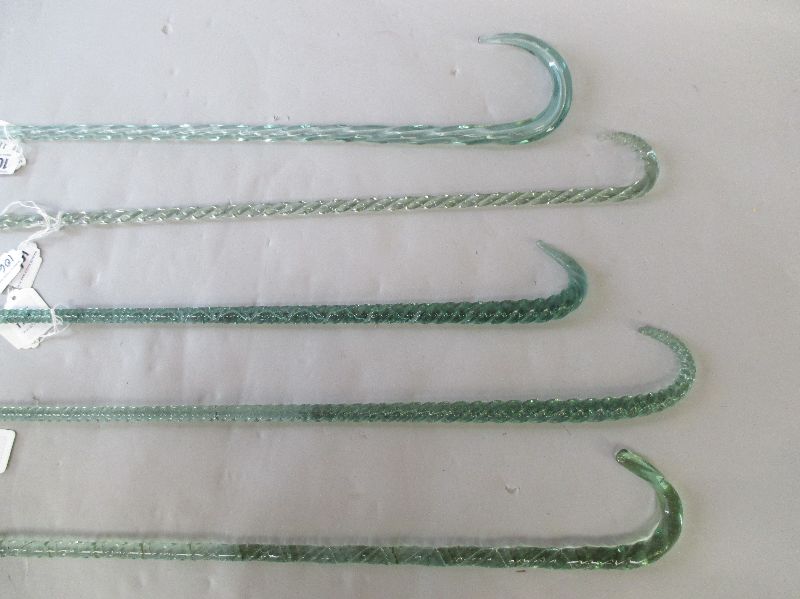 Group of five decorative green spiral twist glass walking sticks (5)