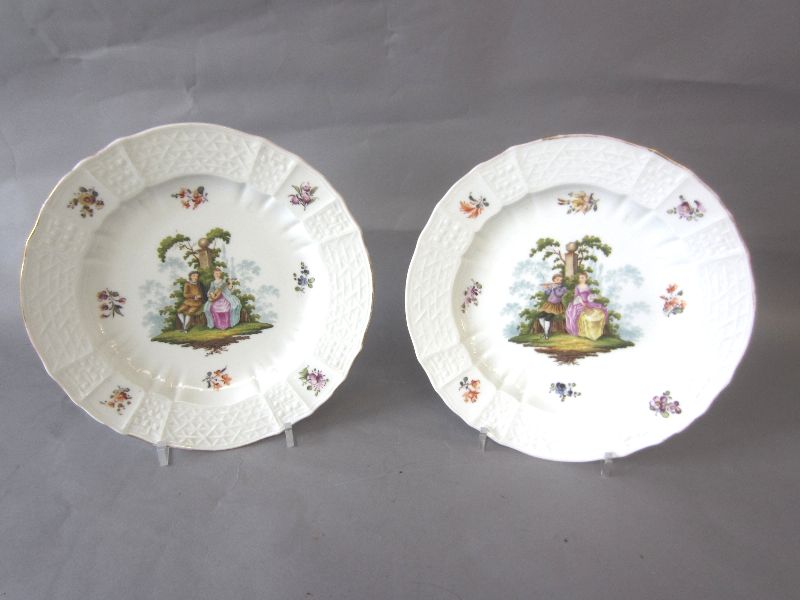 Pair C19th Dresden porcelain saucer dishes decorated in Meissen style, silver shape border with