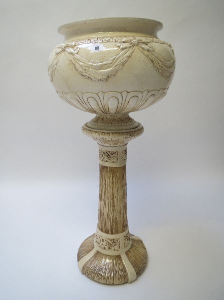 Large Burmantoft circular jardiniere with ribbon swag and tail decoration, on a stand, overall