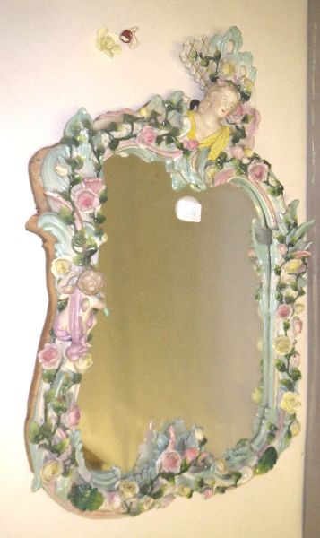 C19th German porcelain Sitzendorf style wall mirror the rococo frame encrusted with flower heads