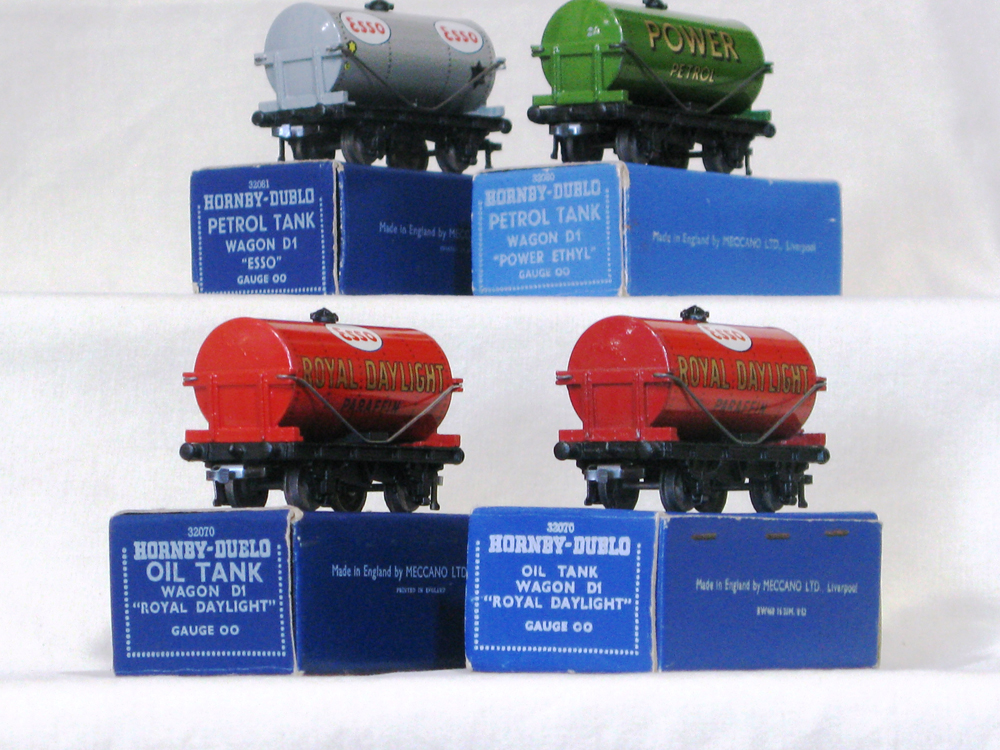 Tank Wagons x 4. Esso (late metal couplings in dark blue box date coded 5:53, Power (early metal