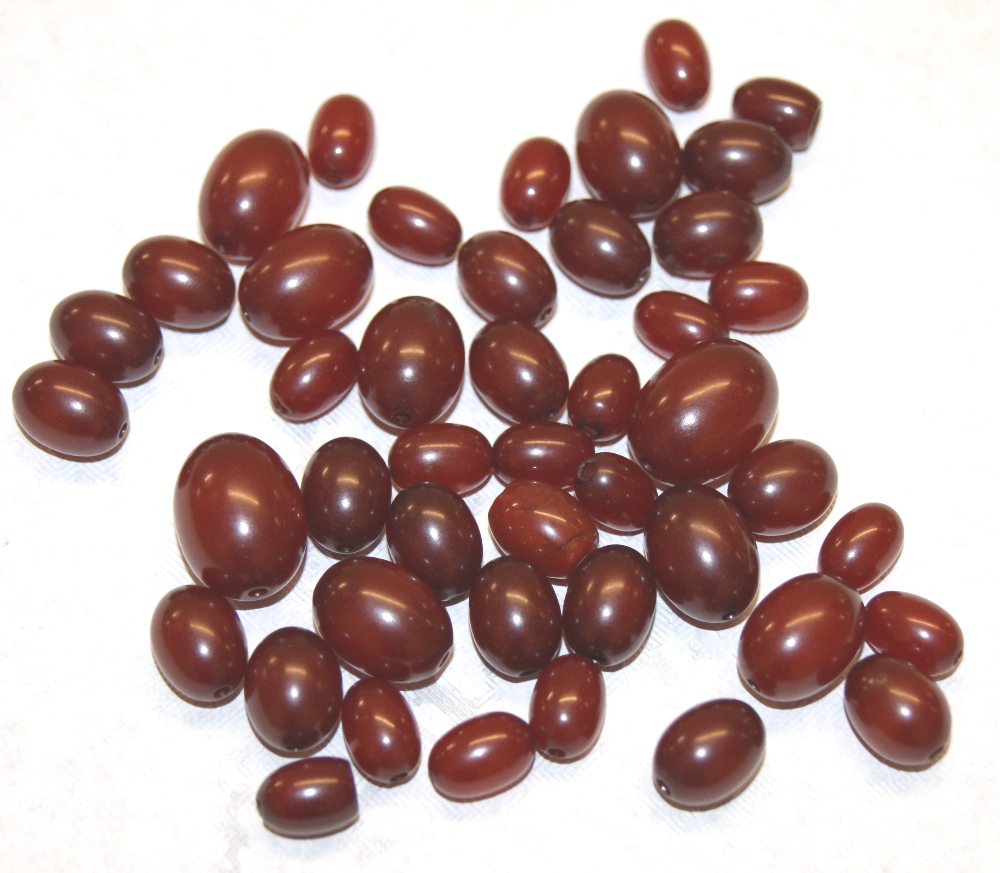 Approximately thirty graduated cherry amber beads