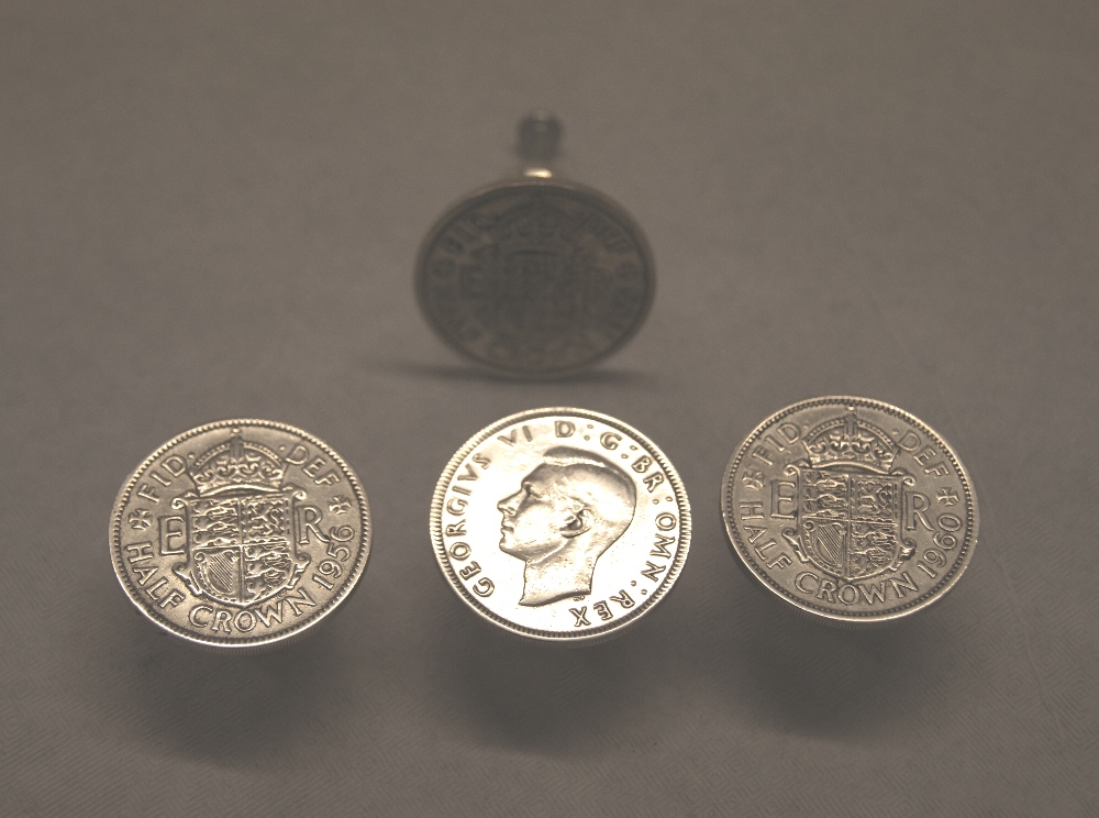 Four silver half crowns, each with handle mount to the reverse