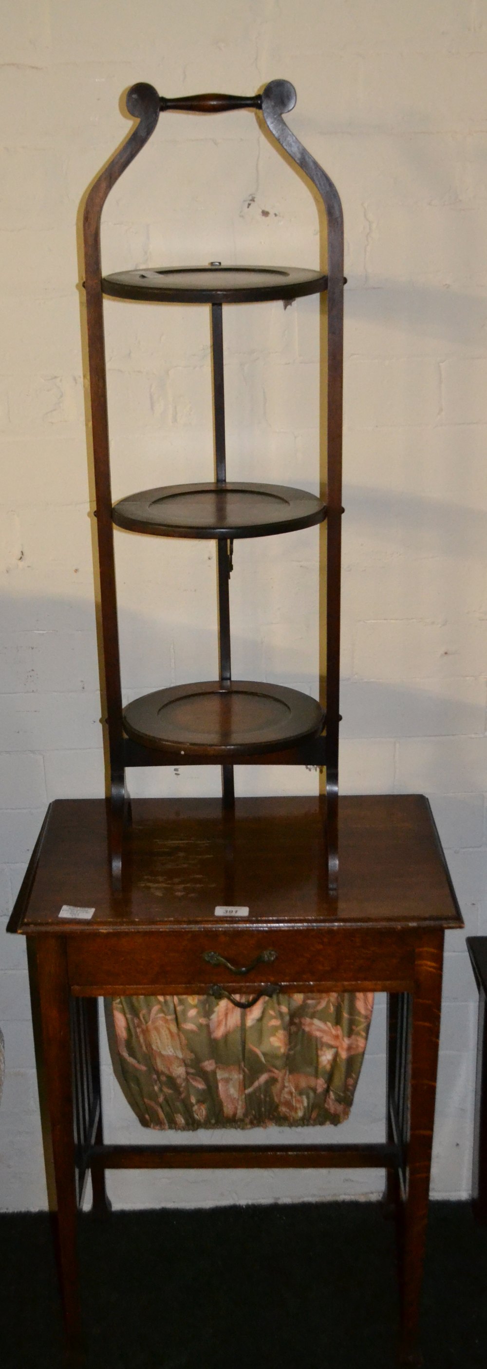 Edwardian mahogany three tier folding cake stand, together with an oak single drawer sewing table