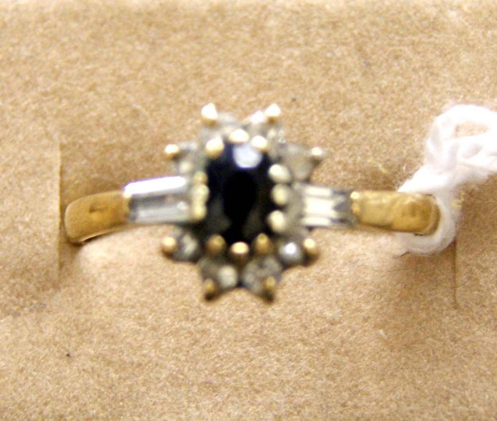 9ct gold ring with sapphire and diamonds. Approximate size S. Total approximate weight 2.7g.