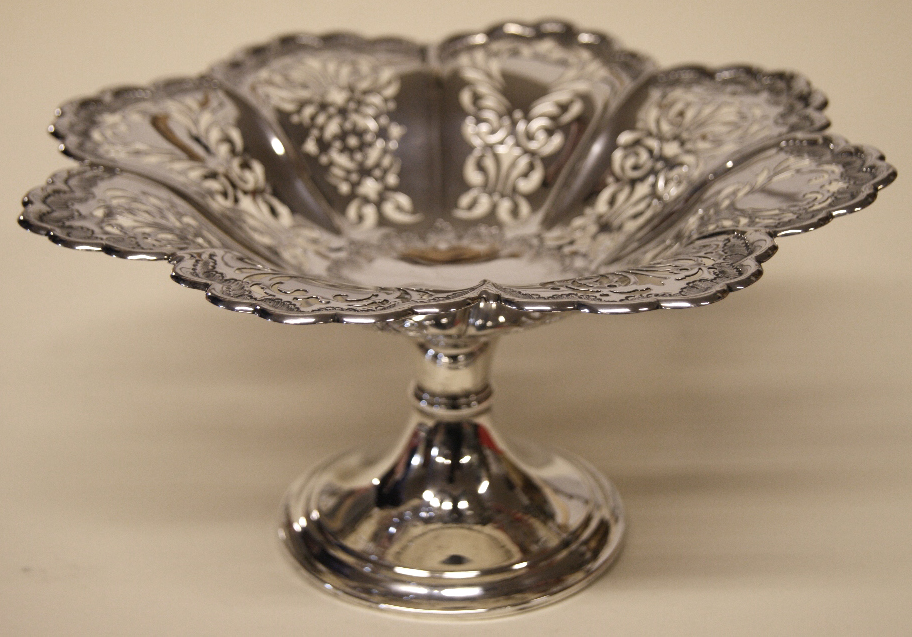 Impressive hallmarked silver table centrepiece, the pierced bowl with repoussé rim above a single