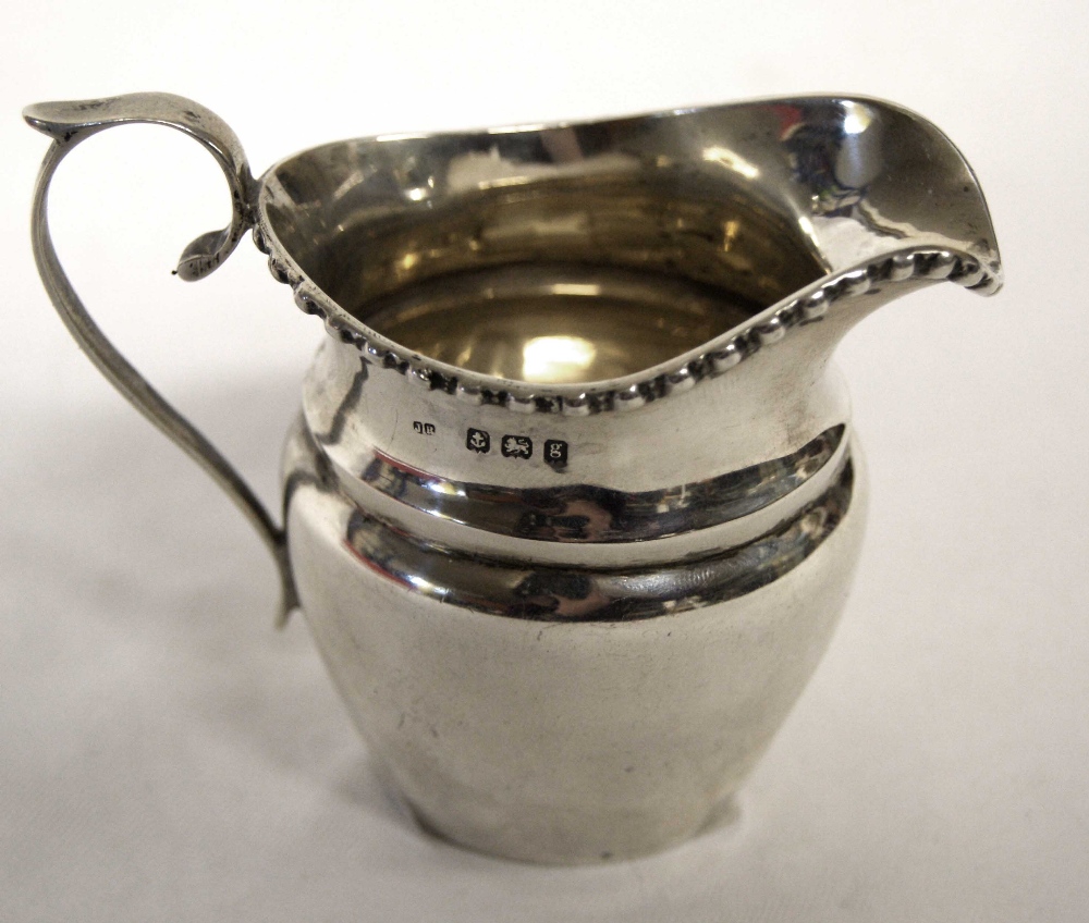 Hallmarked silver cream jug. Approximate weight 70g.