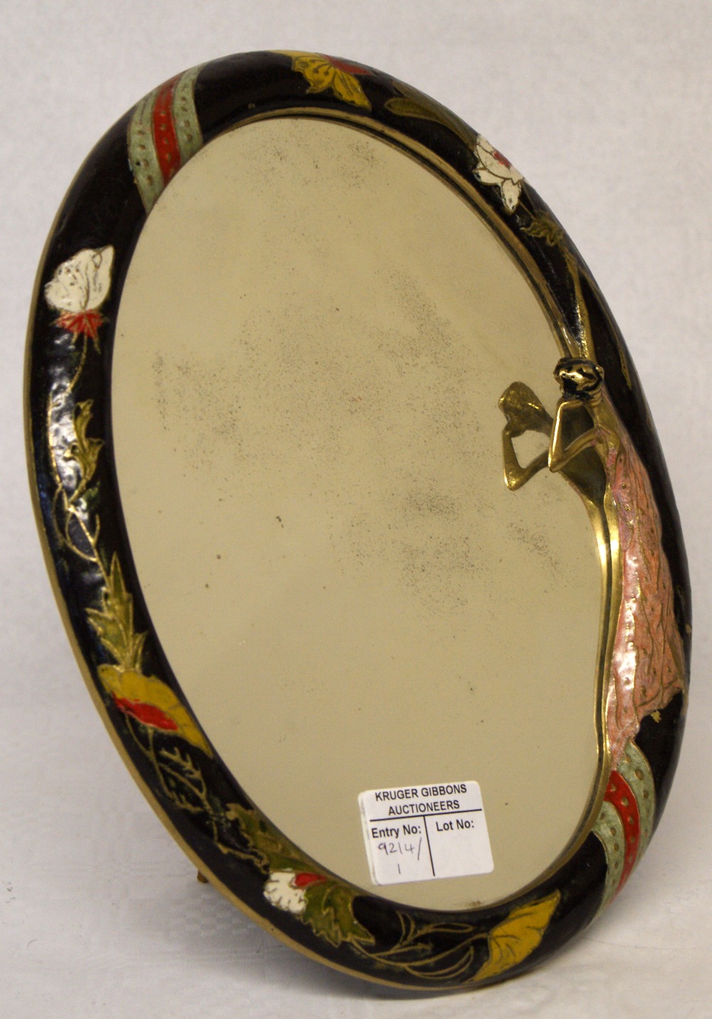 Art Deco oval mirror with patterned enamel brass frame and figure