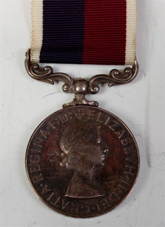 A Queen Elizabeth II R.A.F. Long Service and Good Conduct medal, naming FG OFF C A MITCHELL RAF.