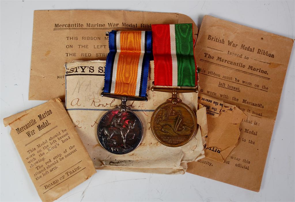 A WW I British war and Mercantile Marine war duo naming Alfred Rowland, with original box and