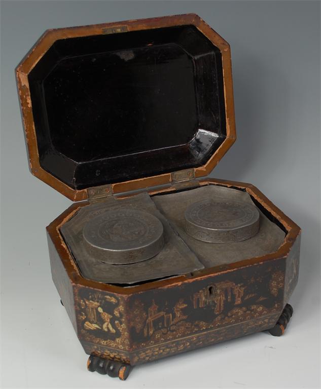 A 19th century Chinese export black lacquered tea caddy, having raised figure decoration (