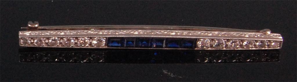 A 1920s white metal (untested but probably platinum) synthetic sapphire and diamond set bar