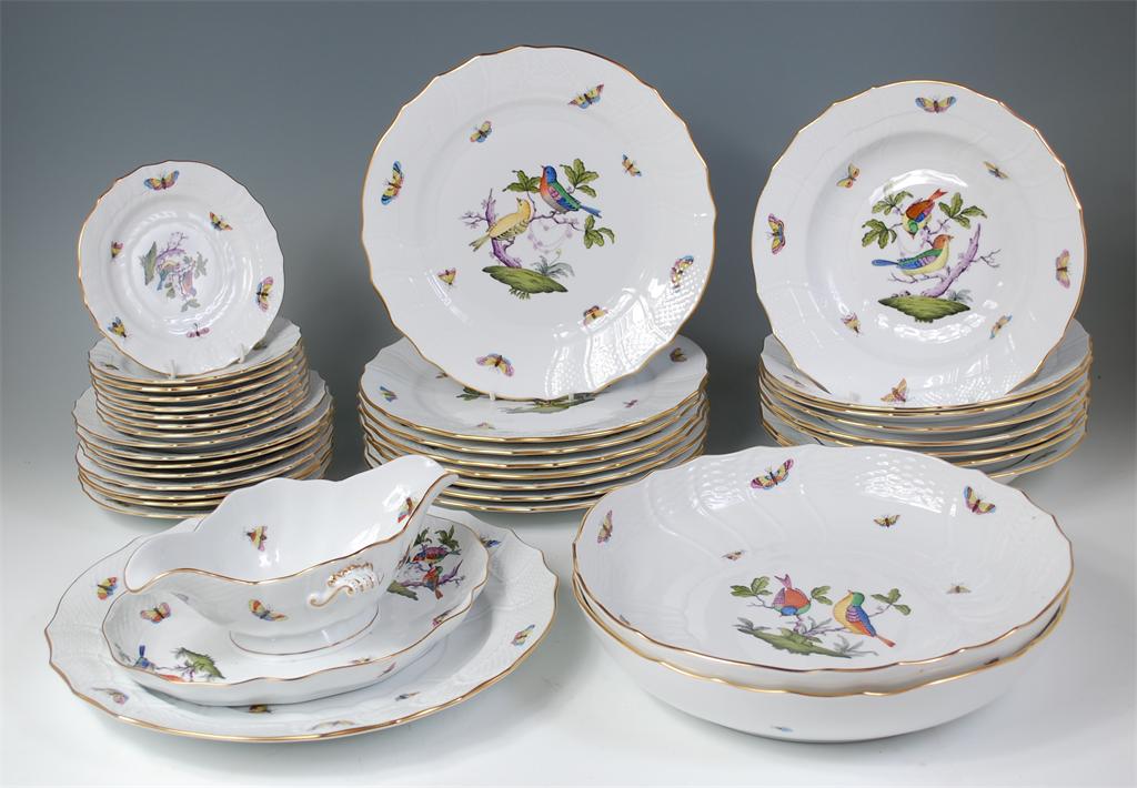 # A Herend porcelain eight place setting dinner service, comprising; dinner plates, side plates, tea