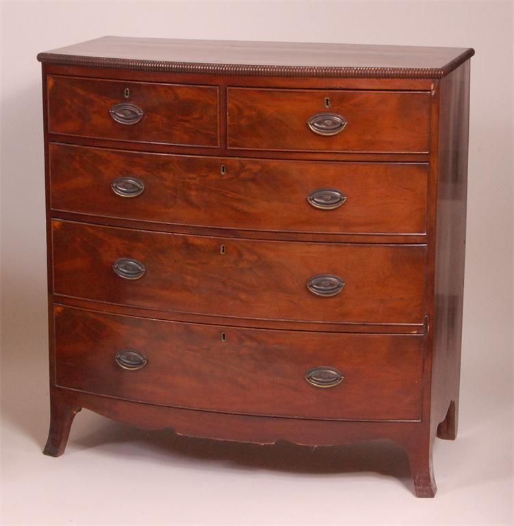 A circa 1830 mahogany crossbanded bowfront chest, of two short and three long graduated drawers,