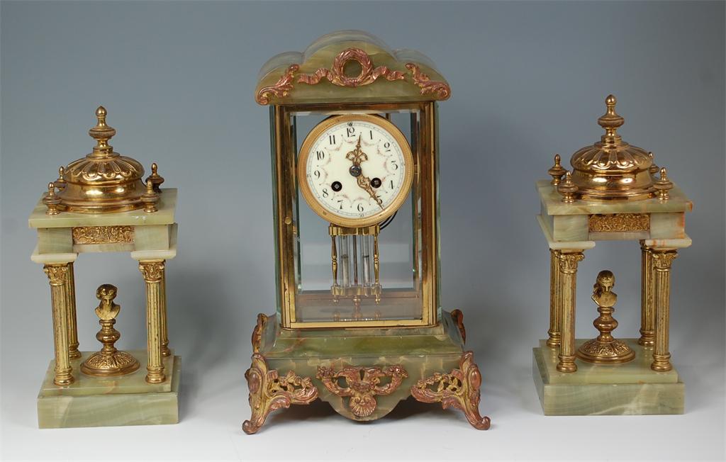 A late 19th century French gilt brass and green onyx mantel clock, with associated later