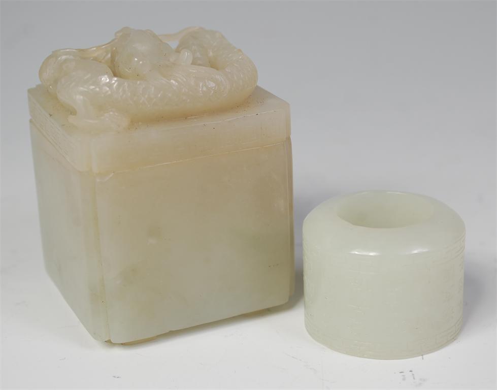 A Chinese celadon jade archers ring, engraved with bands of script and in jade box, the cover carved - Image 2 of 2