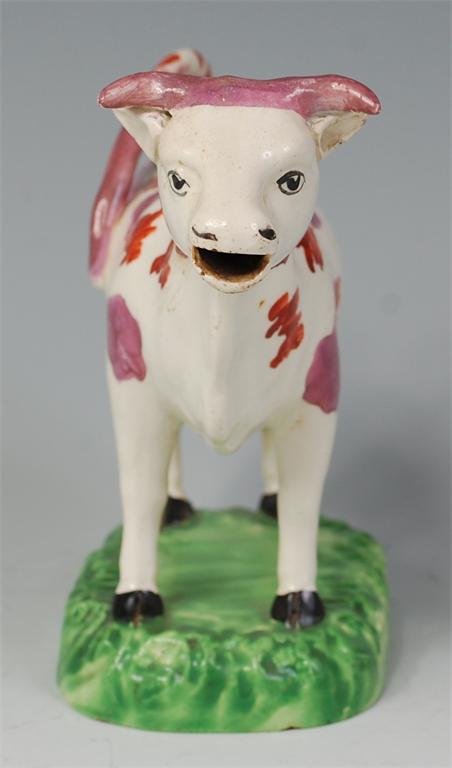 A 19th century Staffordshire cow creamer, polychrome decorated with red spots and sponge decorated - Image 2 of 3