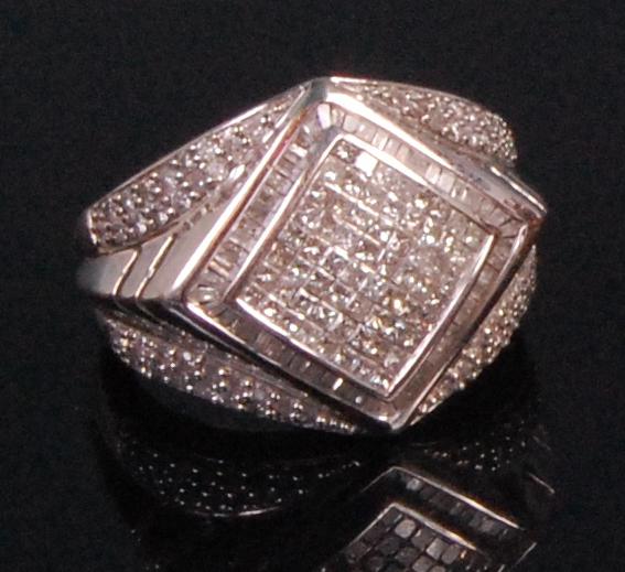 A contemporary 14ct white gold and diamond set gents ring, lozenge set with eight rows of small
