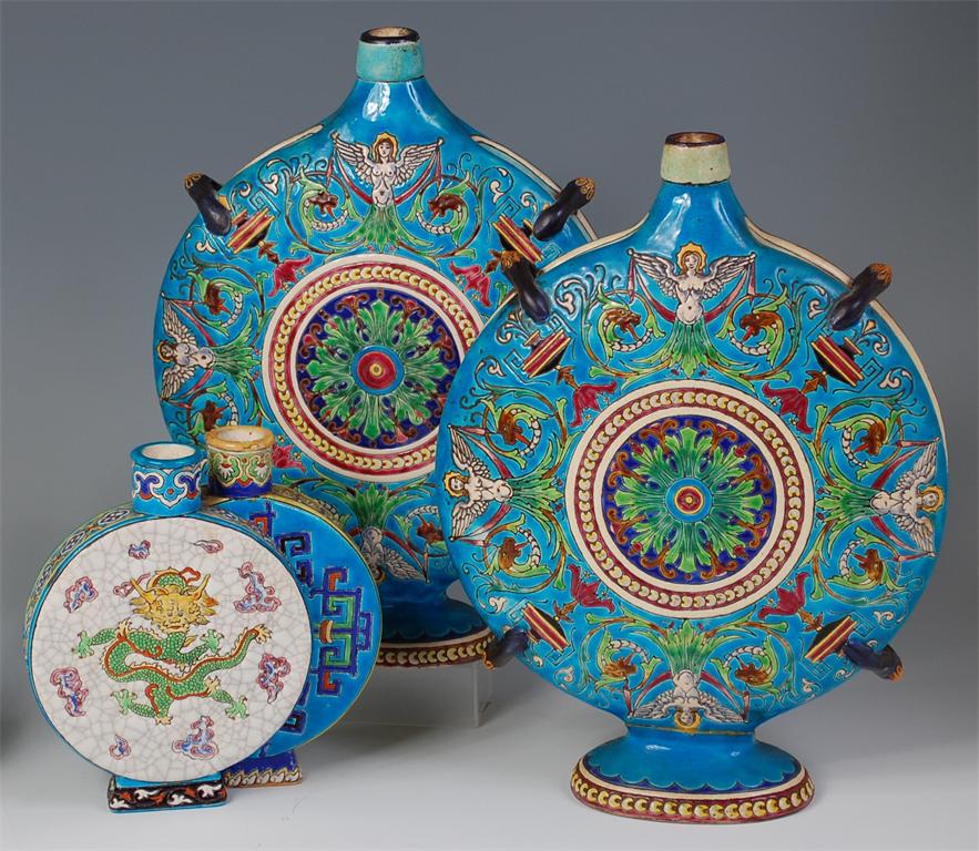 A pair of faience pottery moonflasks, probably Longwy, decorated with winged caryatids and objects - Image 2 of 6