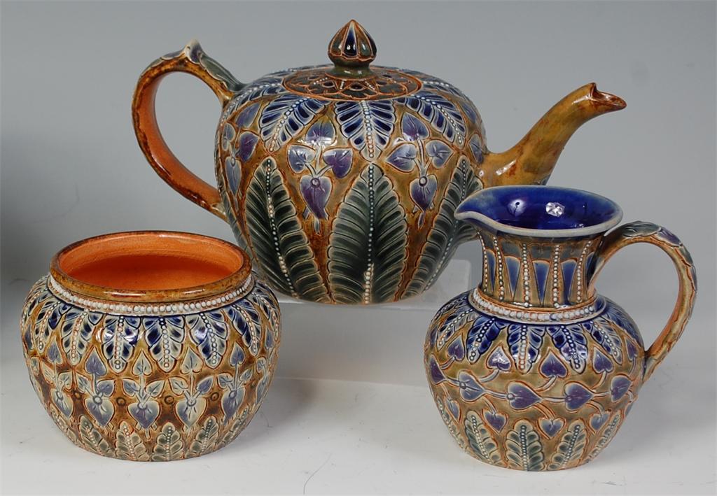 A late Victorian Doulton Lambeth stoneware bachelors three piece teaset by Frances Leigh, each