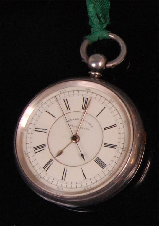 A late Victorian silver cased pocket chronograph, having white enamel dial, seconds sweep and fine