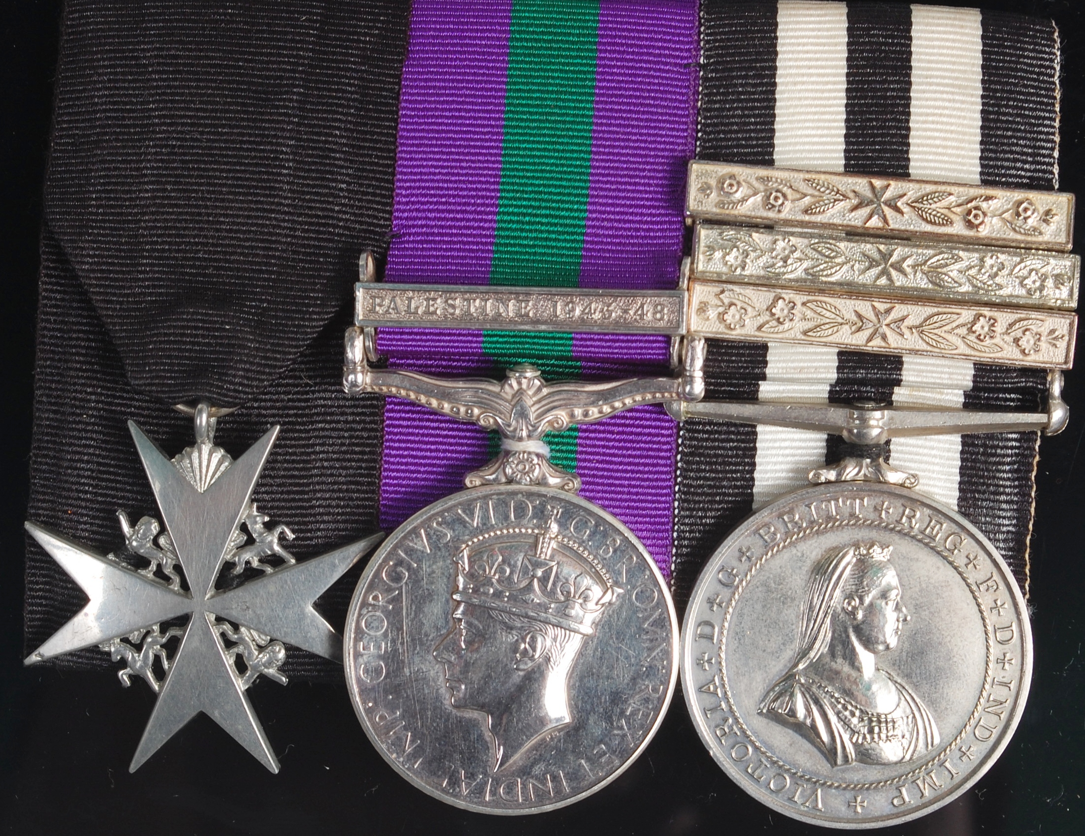 A group of three medals to include Venerable Order of St John, General Service with Palestine 1945-
