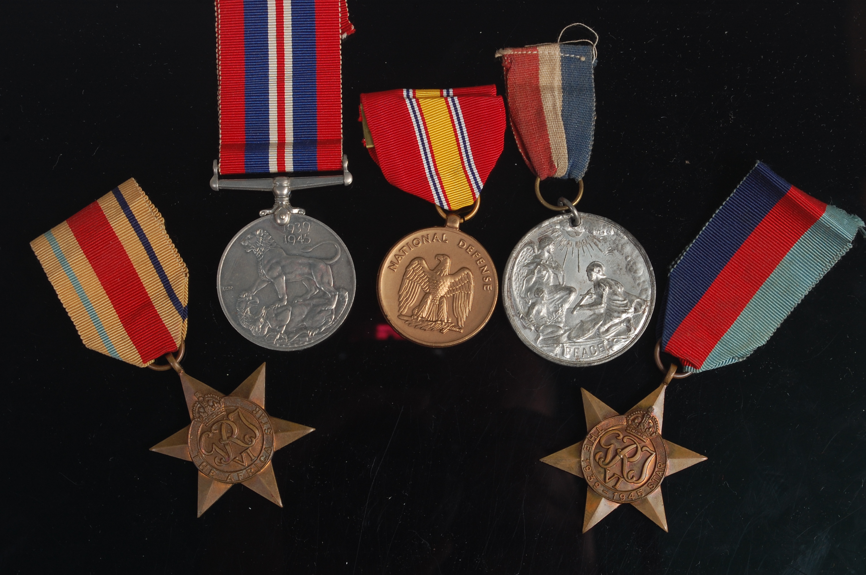 A group of medals to include Great War Peace, 1939-45 Star, Africa Star, Defence and National