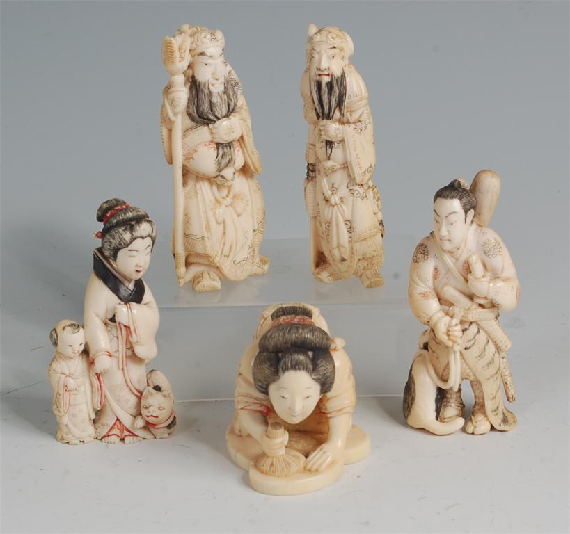 Five various Japanese carved ivory netsuke, Meiji period and later, being two Immortals, a Samurai