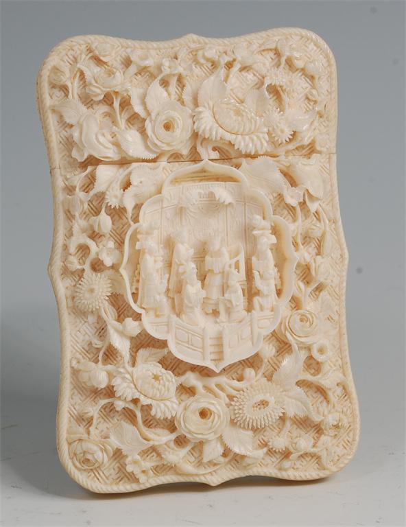 A late 19th century Chinese Canton finely carved ivory calling card case, of shaped rectangular