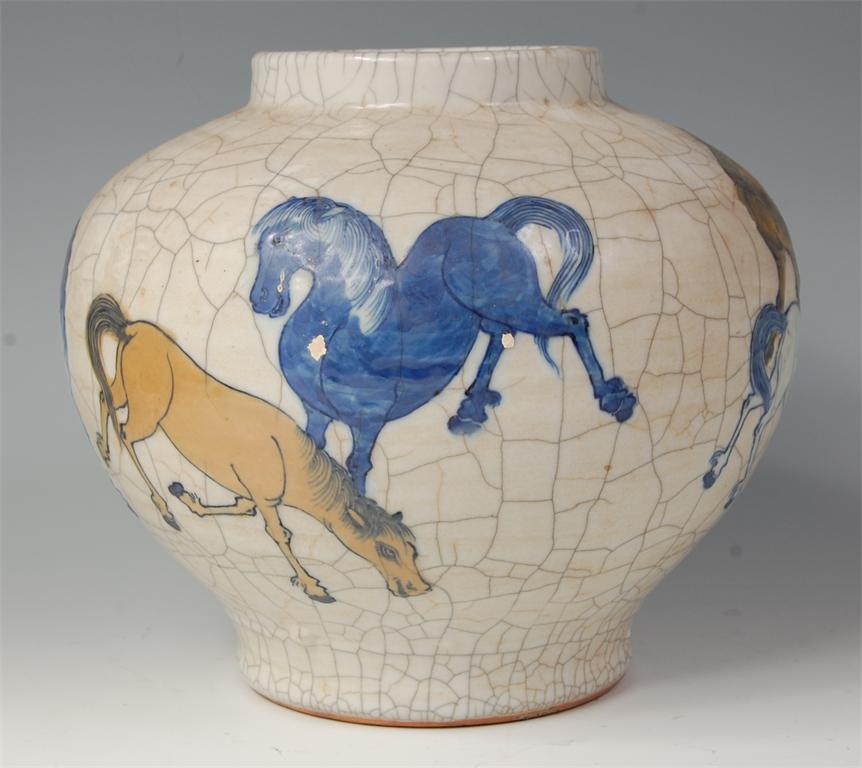 A  19th century Chinese provincial crackle glazed vase, enamel decorated with gamboling horses,