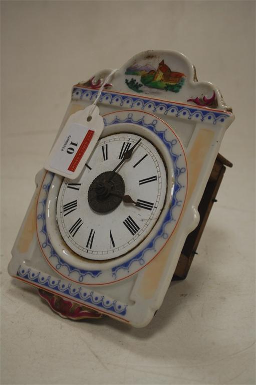 A French miniature porcelain faced wall clock with faux alarm dial