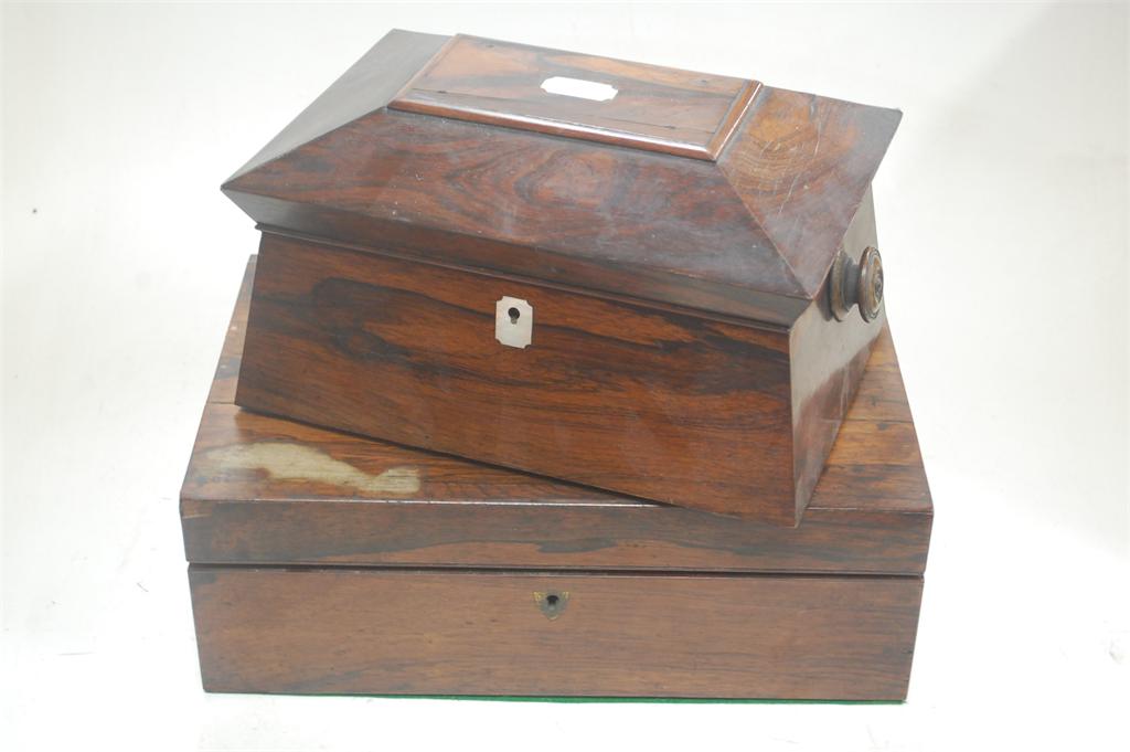 A Victorian rosewood unfitted box of sarcophagus form, a Victorian rosewood writing slope, and a