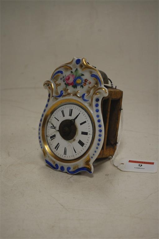 A French porcelain miniature vineyard type clock, bearing English spoof label verso