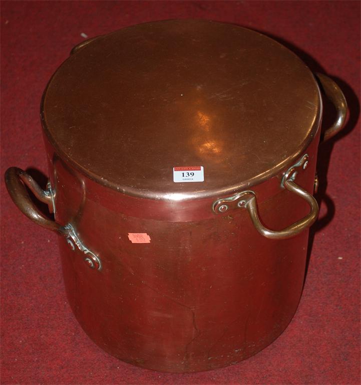 A Victorian copper twin handled pan and cover of good size