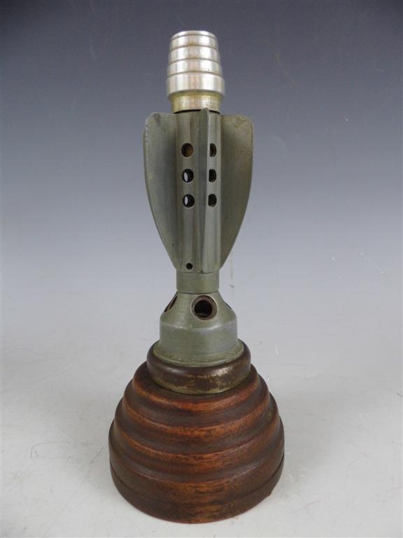 A 1940s table cigarette lighter incorporating the tail fins of a 2-inch mortar projectile