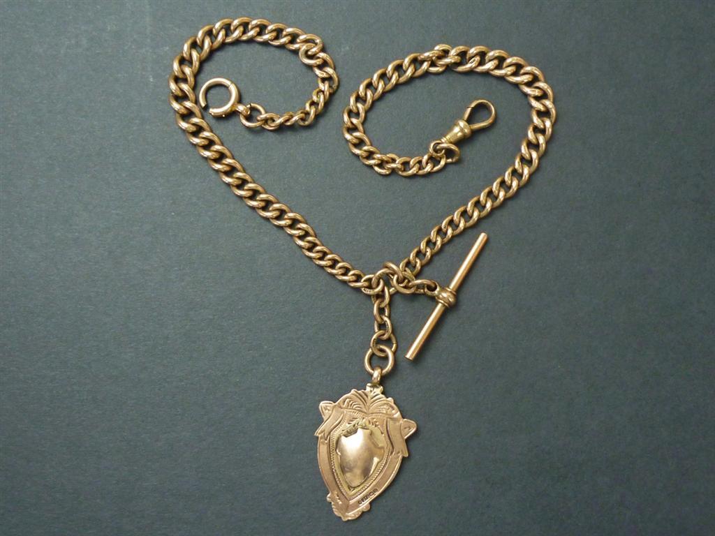 A Victorian 9ct gold double watch chain with swivels, T-bar and fob, 49g