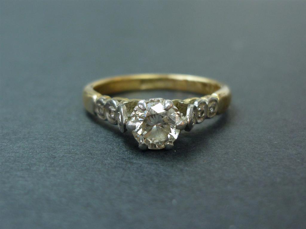 A diamond solitaire ring, the approximately .5 carat brilliant platinum crown set on an 18ct gold