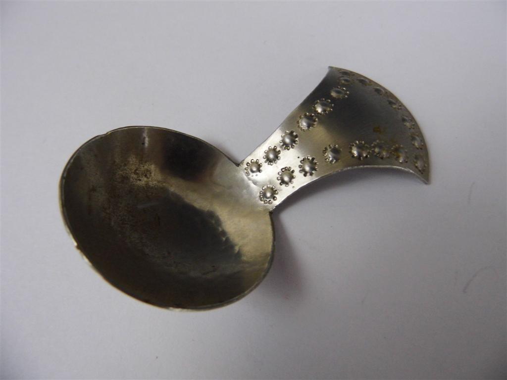 A Keswick School of Industrial Art Staybrite caddy spoon, having punched and planished decoration