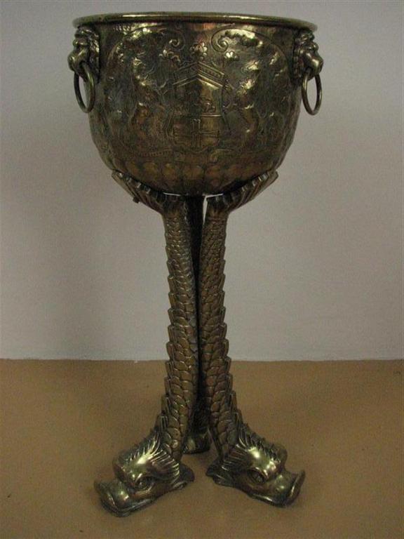 A large late 19th Century brass jardiniere and stand, the jardiniere elaborately chased and