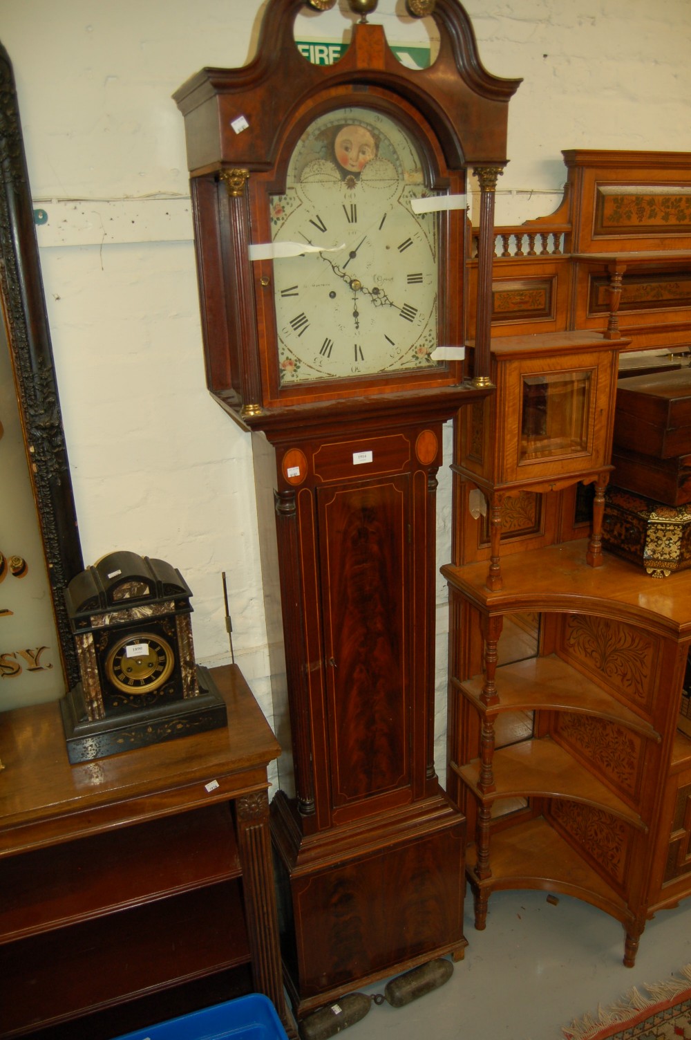George III mahogany boxwood line inlaid longcase clock, the arched hood with a swan neck pediment