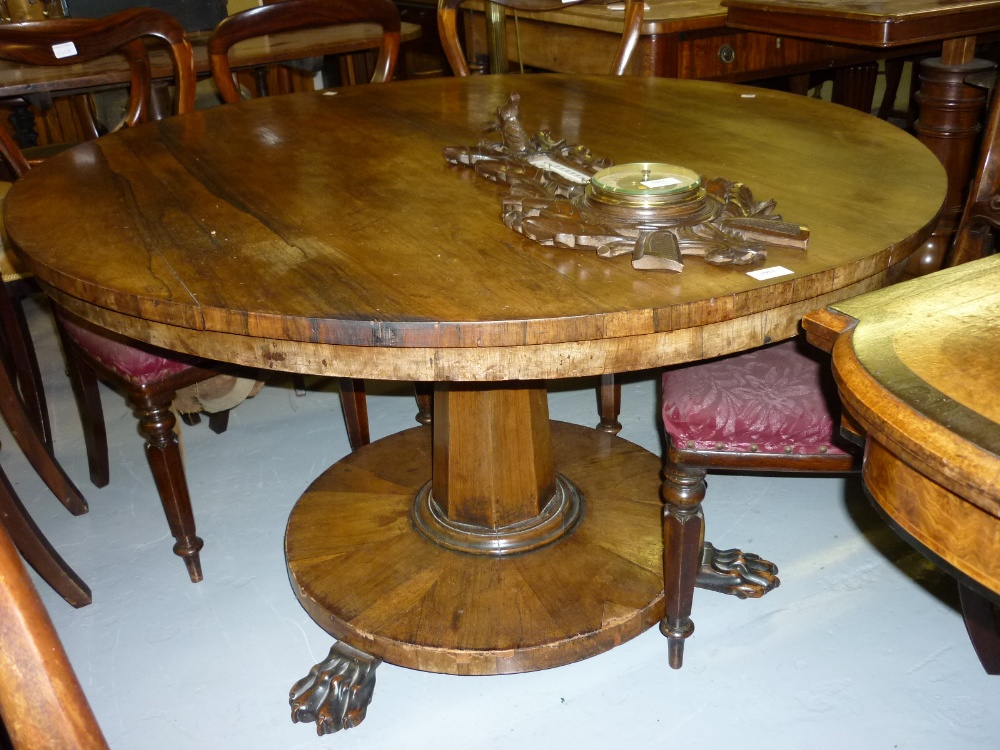Victorian rosewood circular centre table with octagonal tapering column support and circular