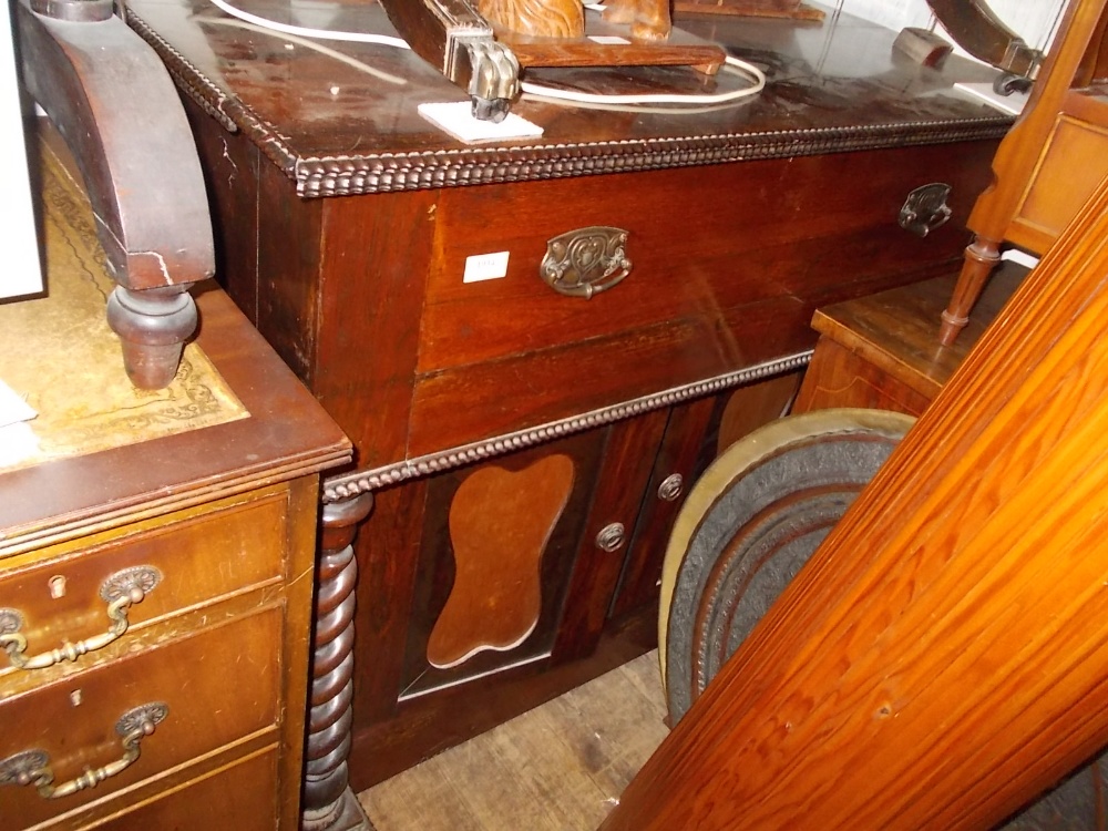 19th Century rosewood side cabinet with a moulded top above a long drawer and two shaped panel doors