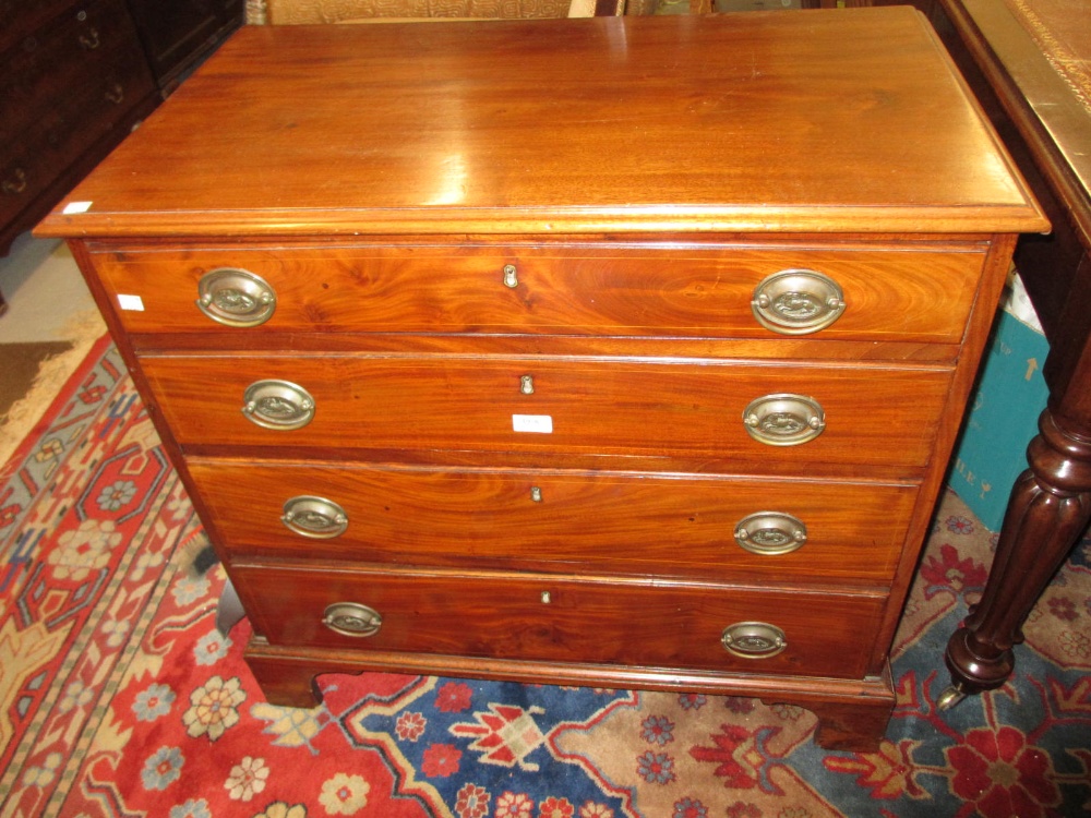 Small George III mahogany boxwood line inlaid dwarf chest of four graduated drawers with oval