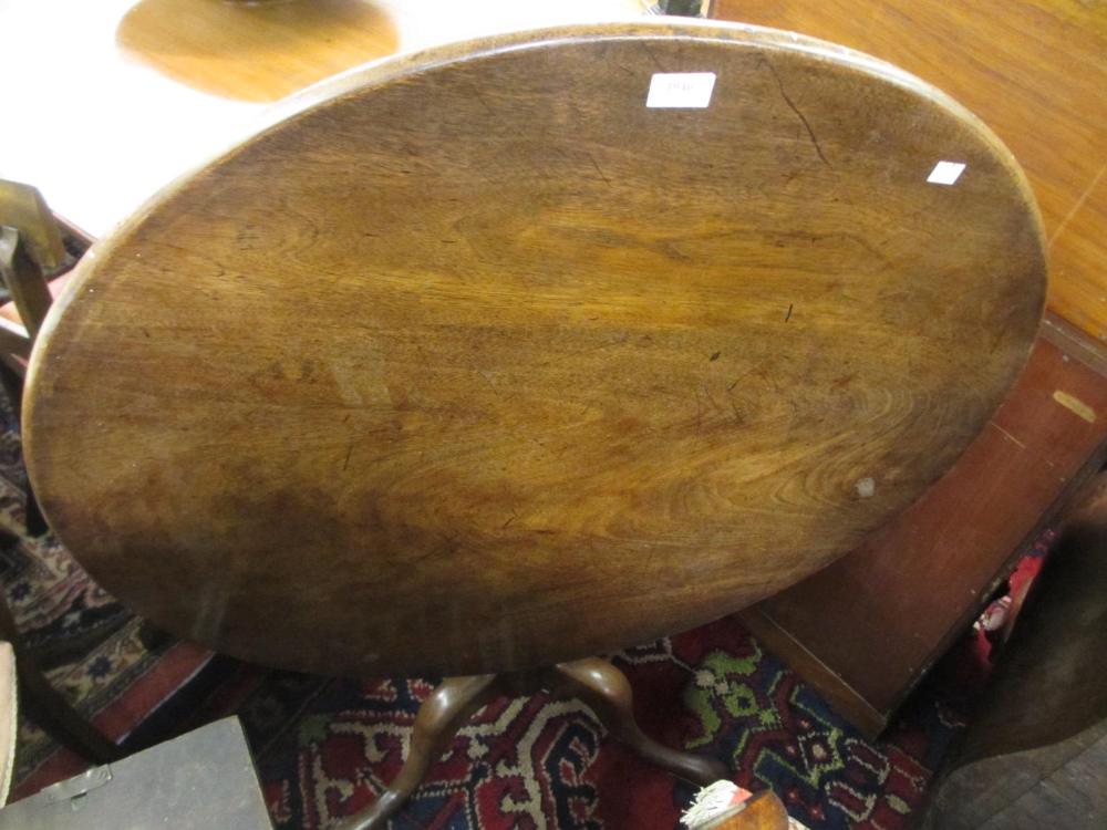 George III mahogany circular pedestal table, the vase turned column support above a tripod base