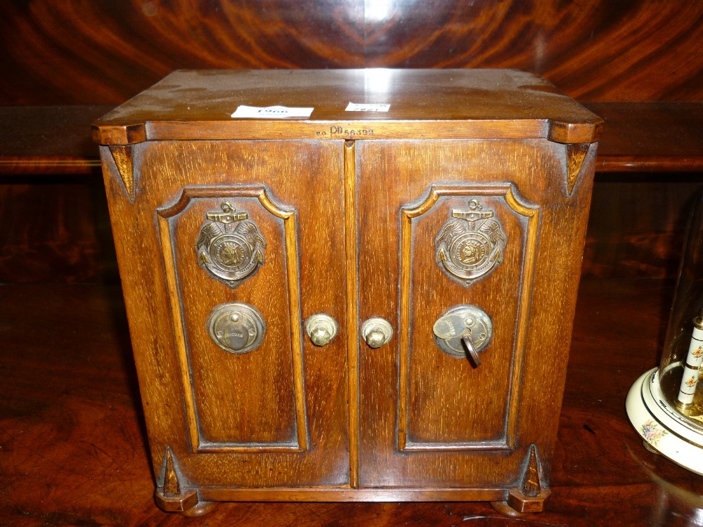 19th Century mahogany tea caddy in the form of a safe with two doors with applied moulding and brass