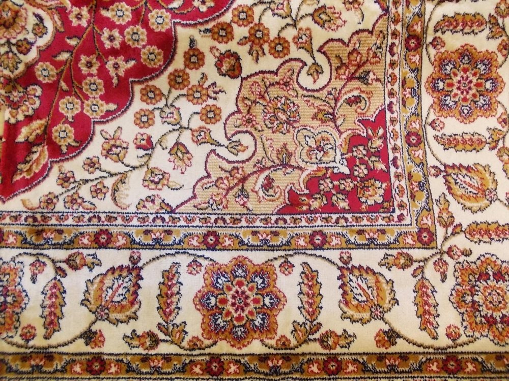 Qum style rug with red ground, 1.9m x 1.4m