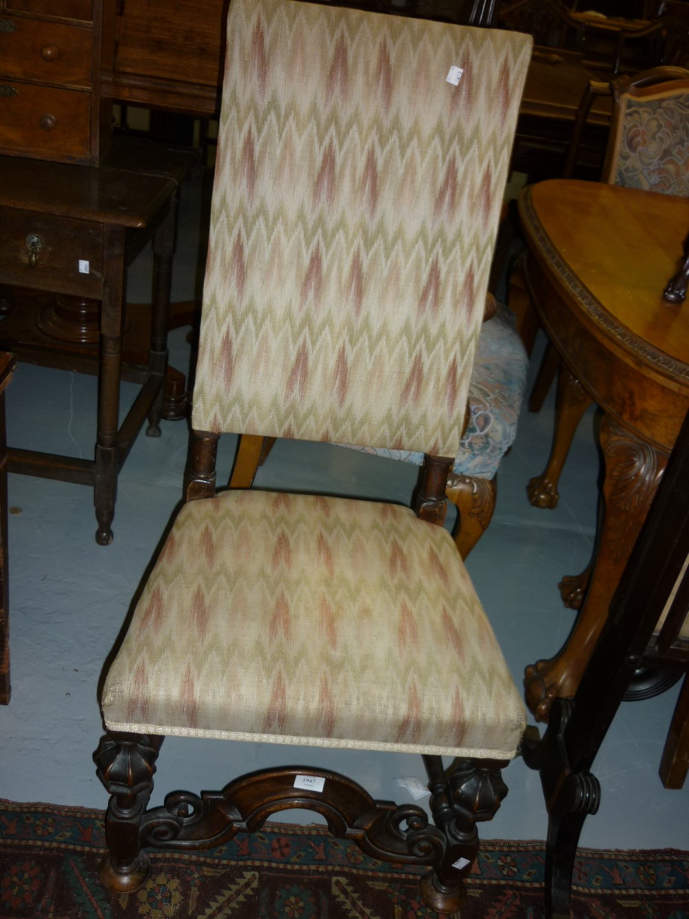 Late 17th Century walnut side chair with rectangular upholstered back and overstuffed seat on ornate